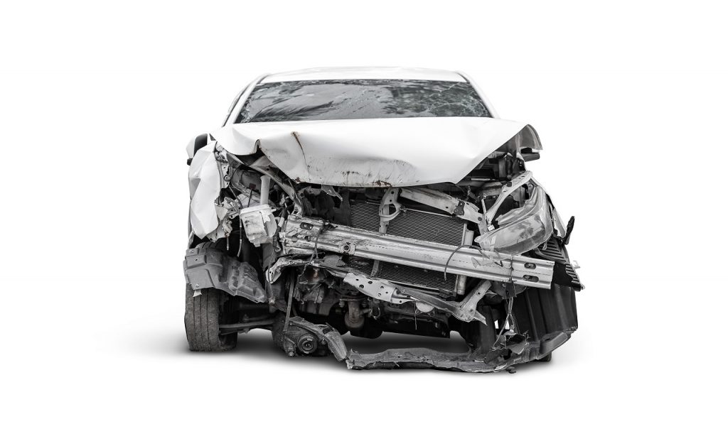 Totaled car involved in accident with white background